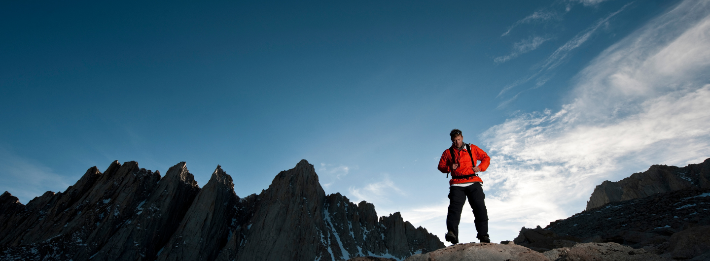 man trekking on mountains during off season